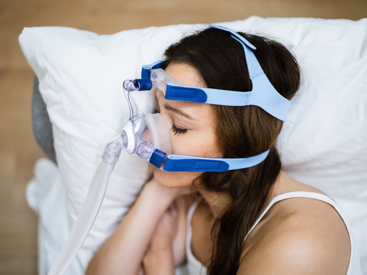 Woman sleeping while experiencing snoring and possible sleep-disordered breathing