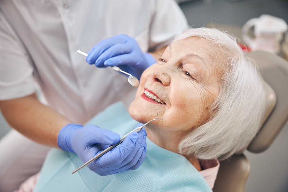 Dentist providing oral care to an older person in residential aged care
