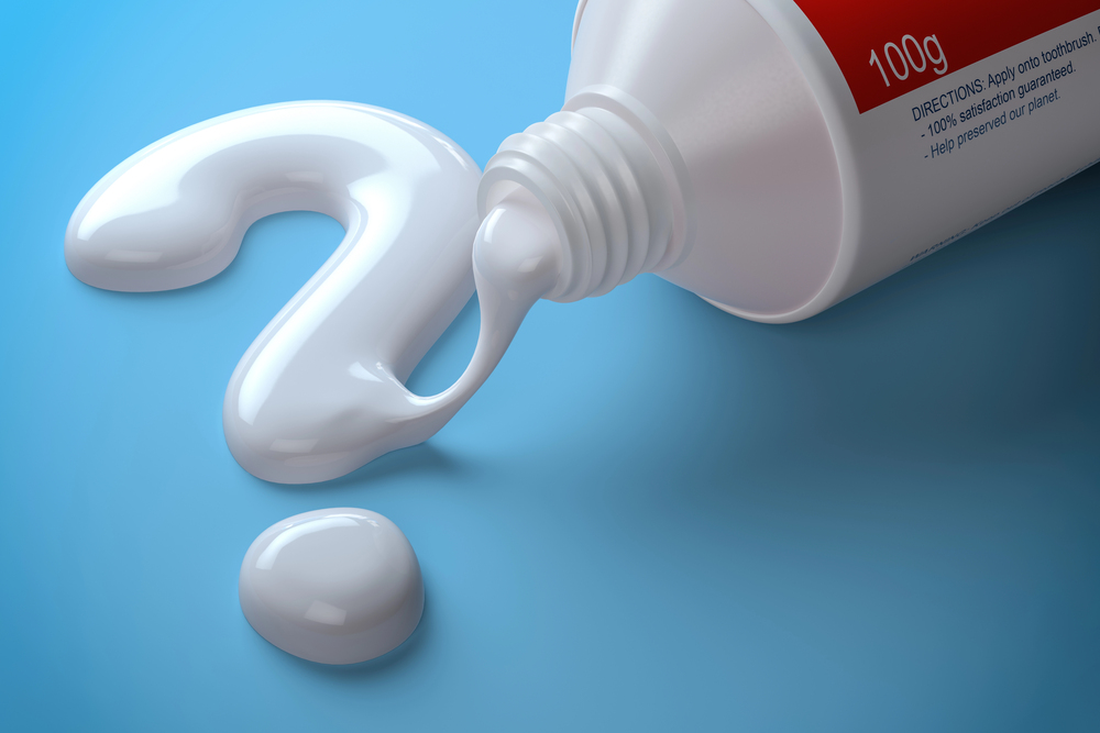 Toothpaste forming a question mark to illustrate how toothpaste supports oral health.