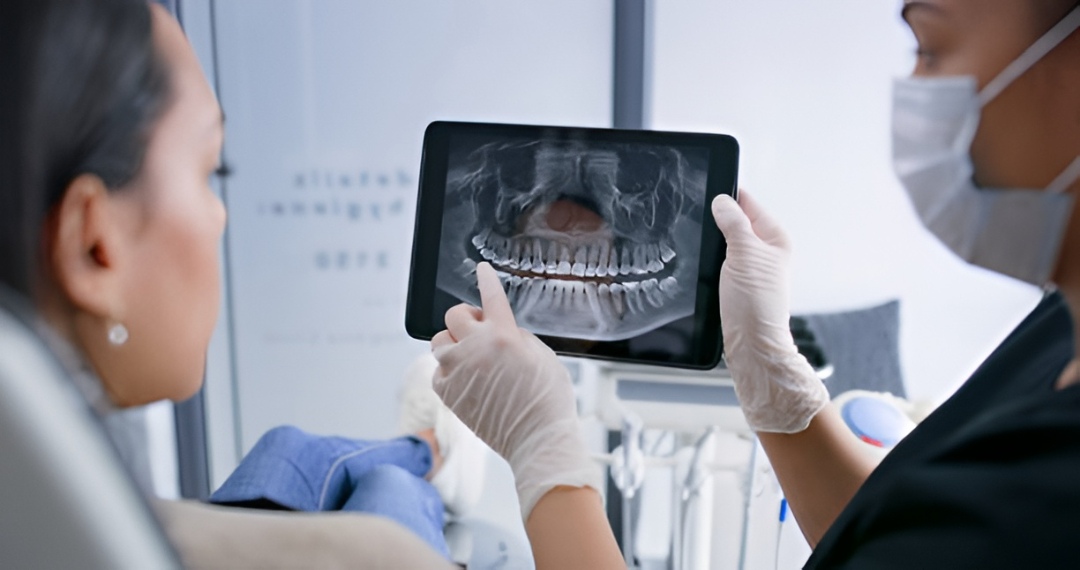 Dentist examining patient gums during dental check-up to assess oral health